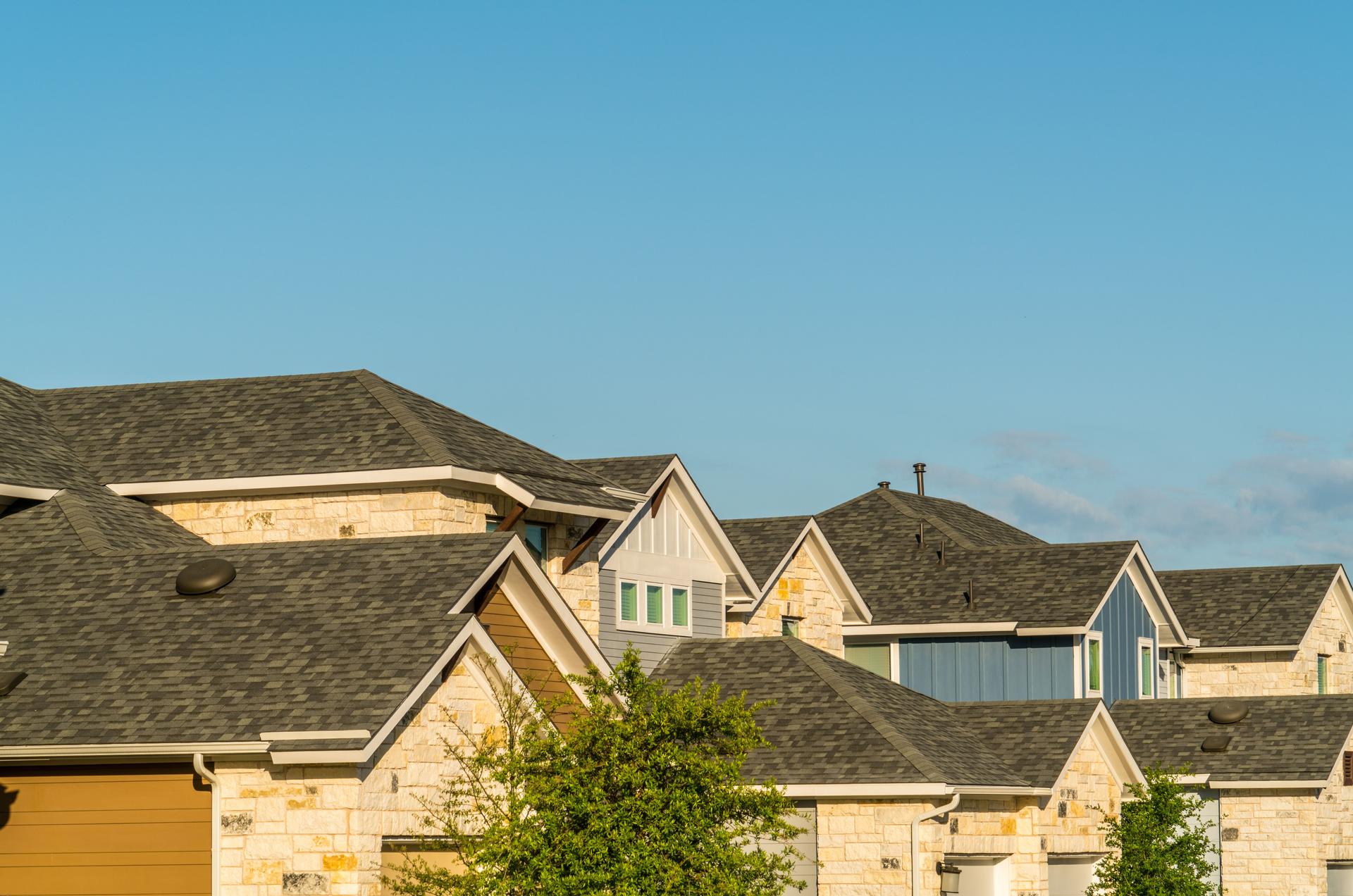 Homes , rooftops , and brick facade